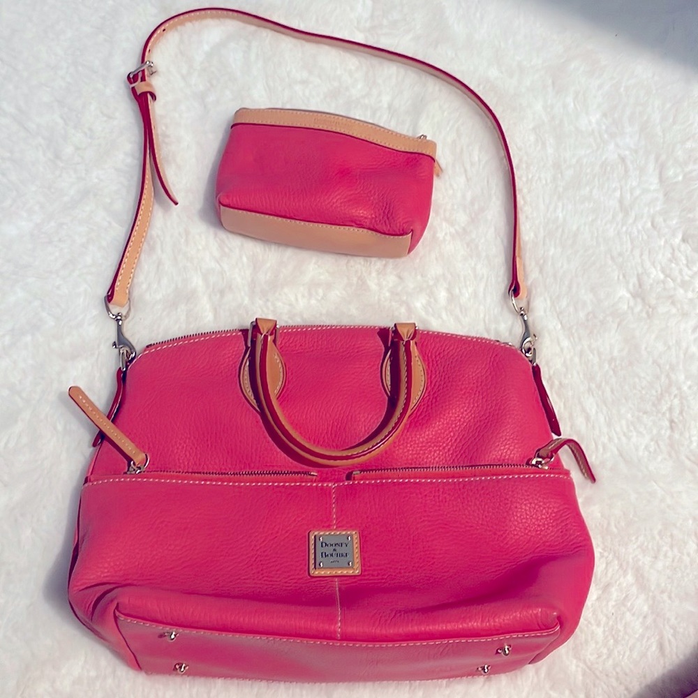 Like new pink, Dooney and Bourke with matching accessory bag.